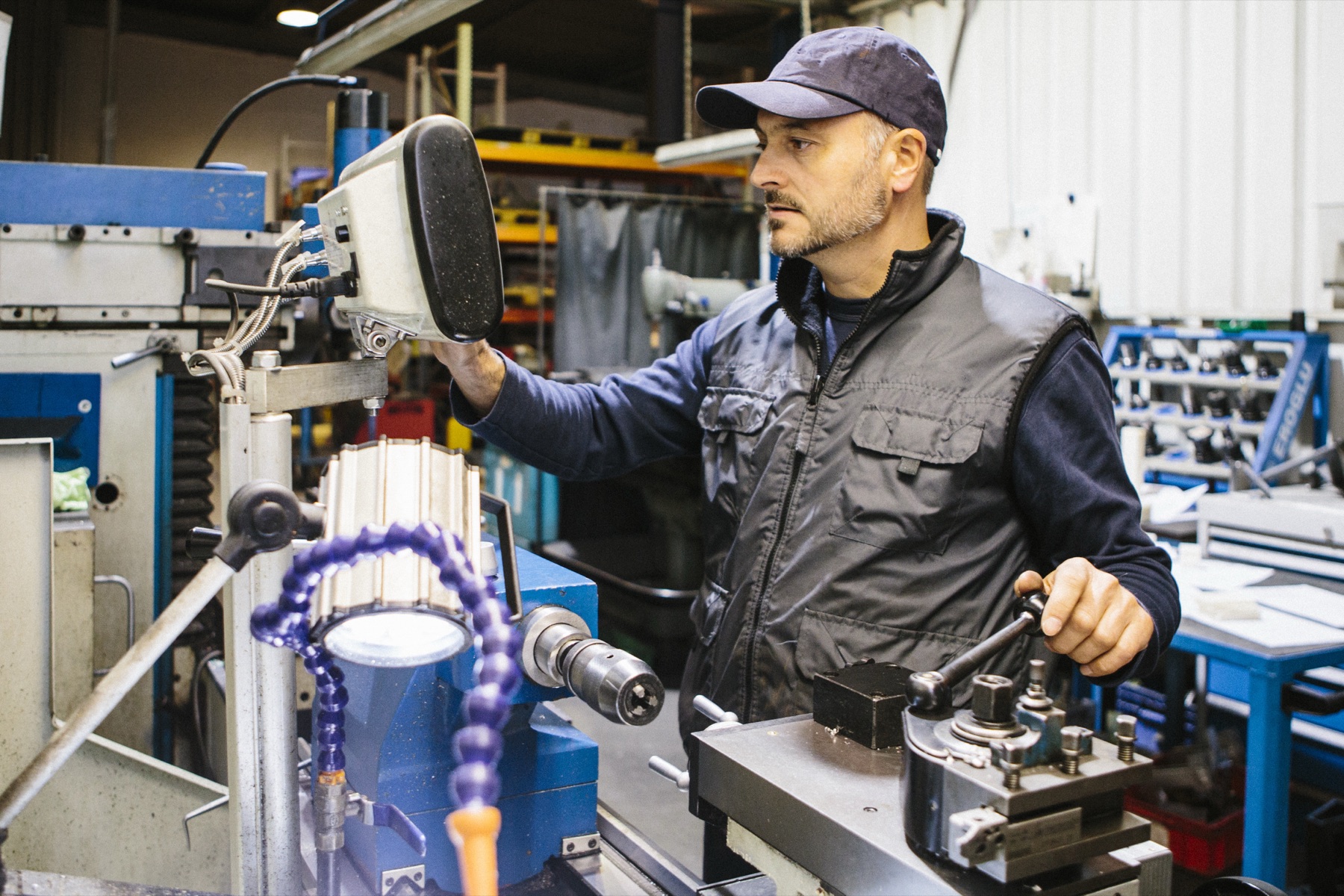 Experienced machinist working at an industrial machine