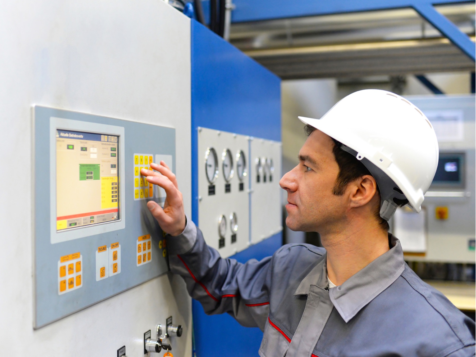 Industrial operator using a machine control panel